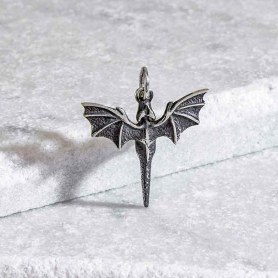 Sterling Silver Flying Dragon Charm on grey backround