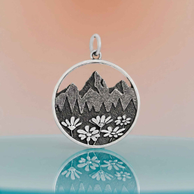 Sterling Silver Mountain Pendant with Flowers on orange background