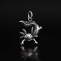 Sterling Silver Axolotl Charm on dark background