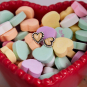 Mixed Metal Heart Earrings in candy dish