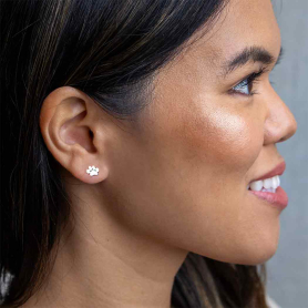 Sterling Silver Paw print post earrings on model