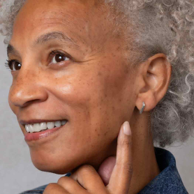 Sterling Silver Diamond Shaped Huggie Hoops on Model