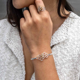 Sterling Silver Honeycomb Cuff Bracelet with Bronze Bee on wrist