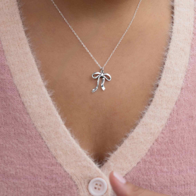 Sterling Silver Droopy Bow Necklace on model