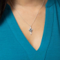 Sterling Silver Cross and Lily Flowers Necklace on model