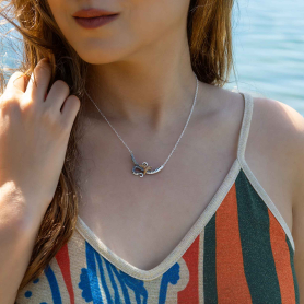 Silver Octopus Tentacle and Bronze Starfish Necklace on womans neck