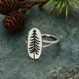 Sterling Silver Etched Pine Tree Ring on green background