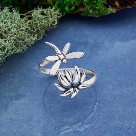 Sterling Silver Adjustable Dragonfly and Lotus Ring on blue background