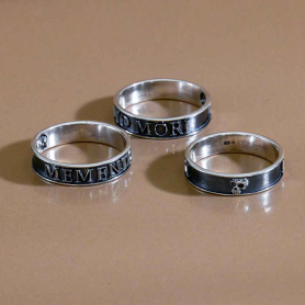 Sterling Silver Memento Mori Ring laying down