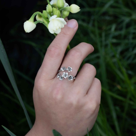 Sterling Silver Adjustable Forget Me Not Ring on hand
