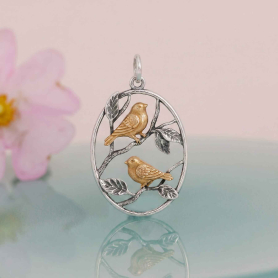 Mixed Metal Chickadee Charm on pink background