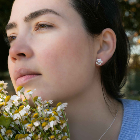 Sterling Silver Pearl Daisy Post Earrings on woman