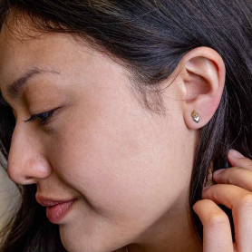 Sterling Silver Heart Post Earrings with Bronze Flame on model