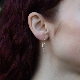 Mixed Metal Mini Dagger Dangle Earrings on ear