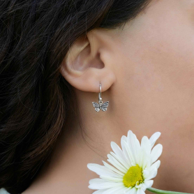 Sterling Silver Textured Butterfly Dangle Earrings on model
