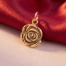Bronze Rose Charm on red background