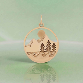 Bronze Mountain Trees and Waves Layered Pendant on green background