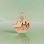 Bronze Mountain Trees and Waves Layered Pendant on green background