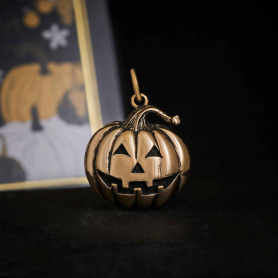 Bronze Jack o Lantern Charm on black background
