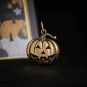 Bronze Jack o Lantern Charm on black background