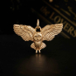 Bronze Flying Owl Charm on black background