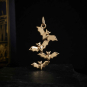 Bronze Bat Cluster Charm on dark background