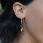 Bronze Long Leaf Hook Earrings on ear