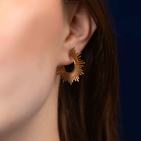 Bronze Sunburst Post Hoop Earrings on ear