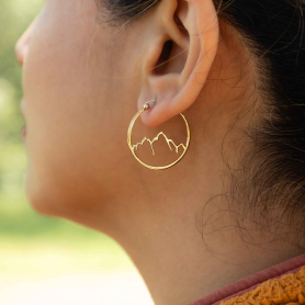 Bronze Openwork Mountain Hoop Earrings on ear