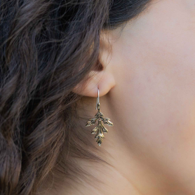 Bronze Mugwort Leaf Earrings on ear