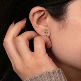 Bronze Phoenix Stud Earrings on ear