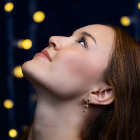 Bronze Cascading Star Earrings 34x12mm on woman's ear