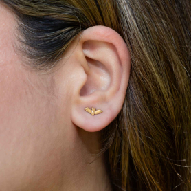 Bronze Small Bat Stud Earrings on ear