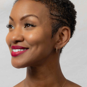 Bronze Oval Huggie Hoops 12x19 on model