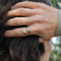 Bronze Adjustable Iris Ring - February Birth Flower on hand