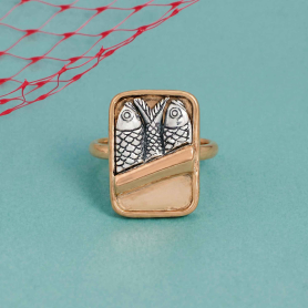 Mixed Metal Sardine Can Ring on blue background