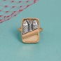 Mixed Metal Sardine Can Ring on blue background