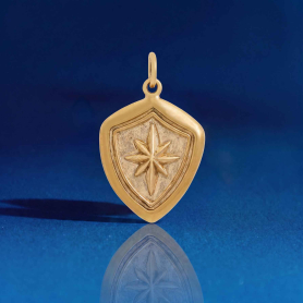 Bronze North Star Shield Wax Seal Charm on blue background