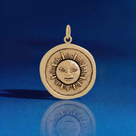 Bronze Sun Face Wax Seal on blue background