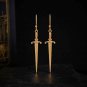 Sword Earrings on dark background