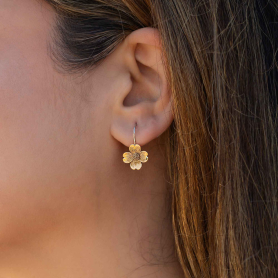 Bronze Dogwood Flower with Hook Earrings on ear