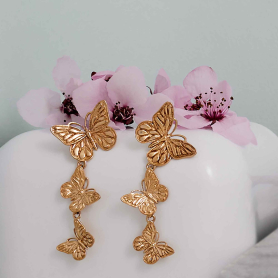 Bronze Butterfly Dangle Earrings on white background