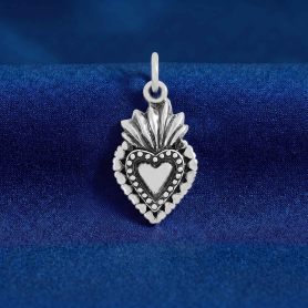 Luxe Silver Plate Sacred Heart Charm on blue backround