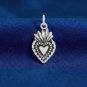 Luxe Silver Plate Sacred Heart Charm on blue backround