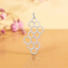 Luxe Silver Plate Honeycomb Charm on yellow background