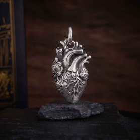 Luxe Silver Plate Anatomical Heart Charm on dark background