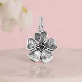 Luxe Silver Plate Cherry Blossom Charm on pink background