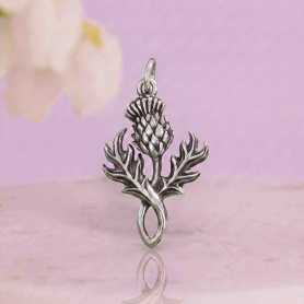 Luxe Silver Plate Thistle Charm light purple background