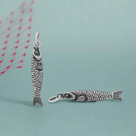 Luxe Silver Plate Small Sardine Charms on blue background