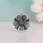 Luxe Silver Plate Peony Charm on blue background